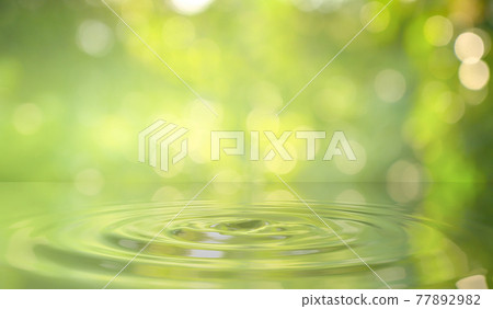 Green water drop background in nature Green water drop background in nature 77892982