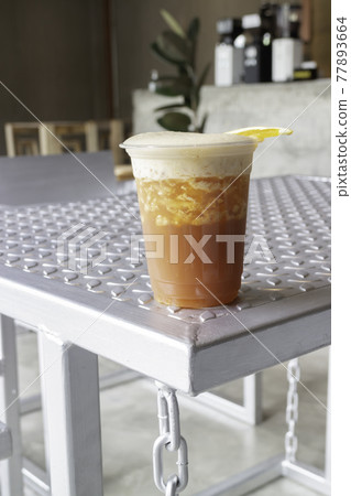 Orange juice and espresso or black tea with orange 77893664