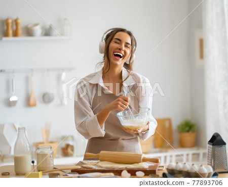 woman is preparing bakery. woman is preparing bakery. 77893706