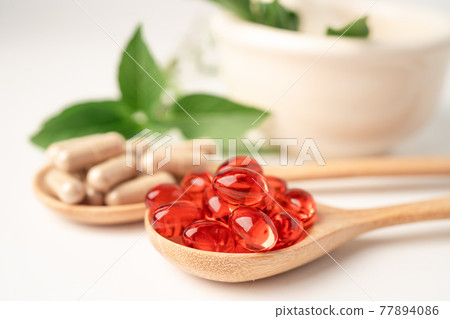 Alternative medicine herbal organic capsule with vitamin E omega 3 fish oil, mineral, drug with herbs leaf natural supplements for healthy good life. 77894086