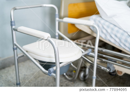 Commode chair or mobile toilet can moving in bedroom or everywhere for elderly old disabled people or patient in hospital, healthy strong medical concept 77894095