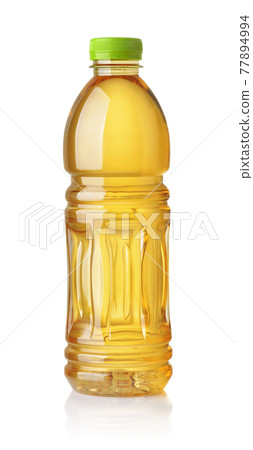 Plastic bottle of apple juice Plastic bottle of apple juice 77894994