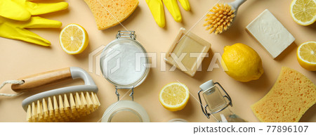Cleaning concept with eco friendly cleaning tools and lemons on beige background 77896107
