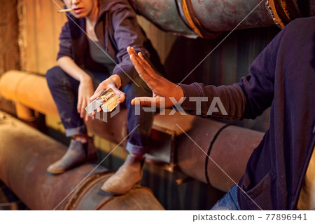 Drug addict man and woman smokes in withdrawal 77896941