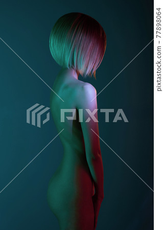 Nude sexy blonde in colorful light. Night club dance Nude sexy blonde in colorful light. Night club dance 77898064