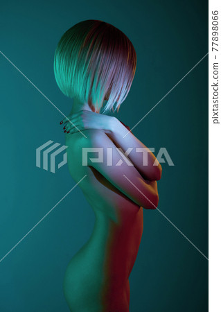 Nude sexy blonde in colorful light. Night club dance Nude sexy blonde in colorful light. Night club dance 77898066