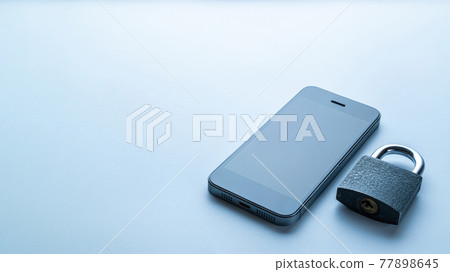 Networking security protection. Modern space grey mobile phone with padlock, key on white background. Smartphone fraud, online scam and cyber security threat. Networking security protection. Modern space grey mobile phone with padlock, key on white background. Smartphone fraud, online scam and cyber security threat. 77898645