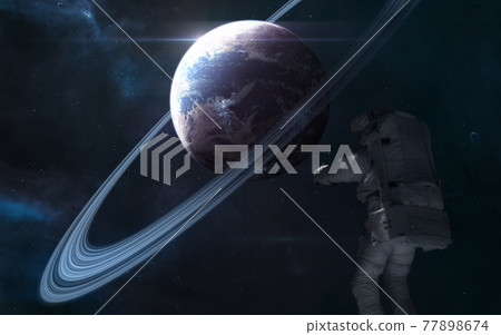 Planet in deep space. Astronaut out of focus Planet in deep space. Astronaut out of focus 77898674