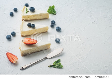 Homemade cheesecake with fresh berries, on white background with copy space for text 77900632