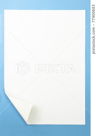 White paper with the left edge turned over, blue background White paper with the left edge turned over, blue background 77900683