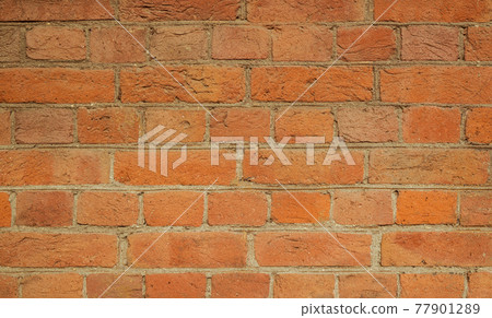Simple hand made brick wall. Detailed photo of brickwork. 77901289