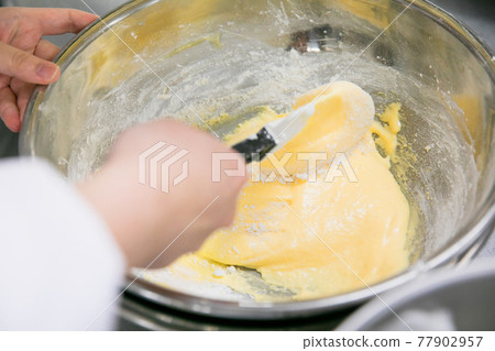 Pastry chef making cake dough Pastry chef making cake dough 77902957