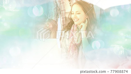 Composition of smiling woman using laptop in office with white overlay Composition of smiling woman using laptop in office with white overlay 77908874