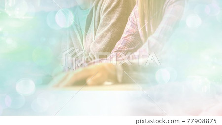 Composition of midsection of people with green overlay Composition of midsection of people with green overlay 77908875