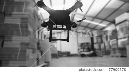 Drone flying over a warehouse in black and white, delivery and technology concepts Drone flying over a warehouse in black and white, delivery and technology concepts 77909378