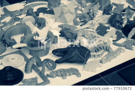 Models printed by 3d printer. Bright colorful objects printed on a 3d printer Models printed by 3d printer. Bright colorful objects printed on a 3d printer 77910672