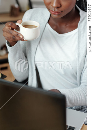 Pensive woman working on laptop Pensive woman working on laptop 77911467