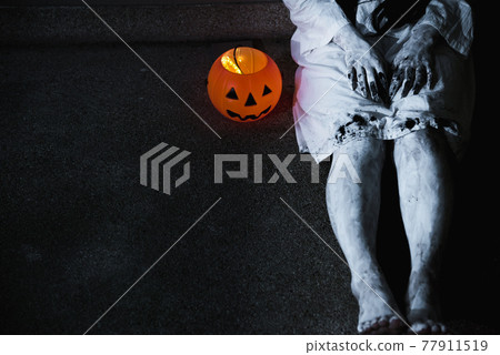 Woman ghost horror her have pumpkin beside body, 77911519