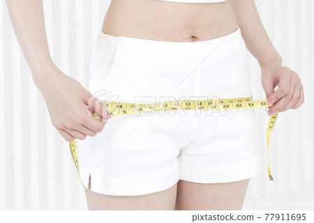 hip and calvis tape measure, body size and diet concept hip and calvis tape measure, body size and diet concept 77911695