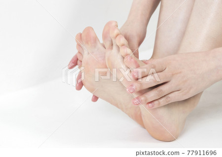 closeup of hands holding feet closeup of hands holding feet 77911696