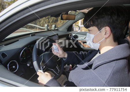 wearing mask in car, covid virus wearing mask in car, covid virus 77911754
