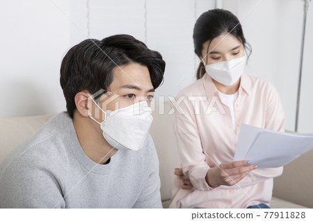 Asian couple waiting for covid test result 77911828