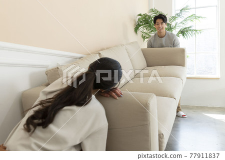 Asian newlyweds, couple moving sofa Asian newlyweds, couple moving sofa 77911837