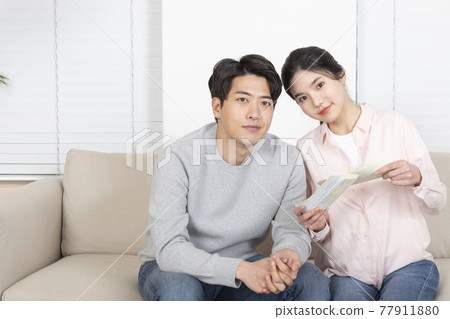 Asian newlyweds, couple managing home living expense 77911880