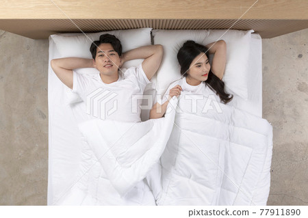 Asian newlyweds, couple lying in bed Asian newlyweds, couple lying in bed 77911890