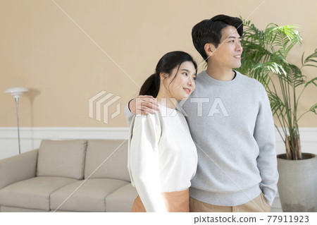 newly married Asian couple at home 77911923