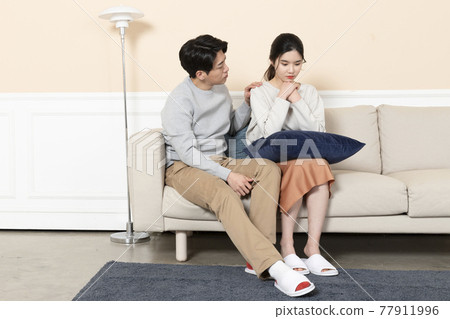 Asian husband comforting, calming down Asian wife Asian husband comforting, calming down Asian wife 77911996