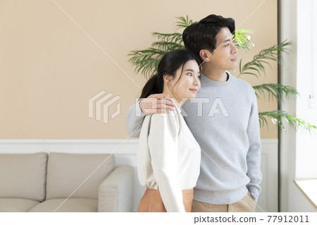 newly married Asian couple at home 77912011