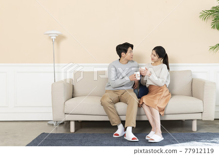 newly married Asian couple at home concept, drinking coffee 77912119