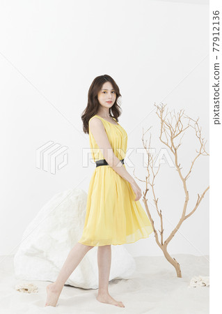 beautiful Asian model in yellow dress, spring beauty concept beautiful Asian model in yellow dress, spring beauty concept 77912136