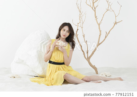 beautiful Asian model in yellow dress, spring beauty concept beautiful Asian model in yellow dress, spring beauty concept 77912151
