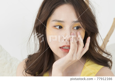 beautiful Asian model in yellow dress, spring beauty concept beautiful Asian model in yellow dress, spring beauty concept 77912166