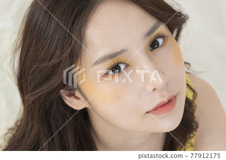 beautiful Asian model in yellow dress, spring beauty concept beautiful Asian model in yellow dress, spring beauty concept 77912175