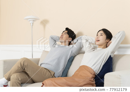 newly married Asian couple at home concept, sitting on sofa newly married Asian couple at home concept, sitting on sofa 77912179