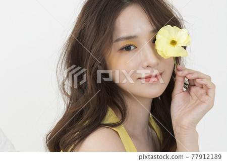 beautiful Asian model in yellow dress, spring beauty concept beautiful Asian model in yellow dress, spring beauty concept 77912189
