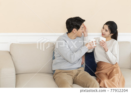 newly married Asian couple at home concept, drinking coffee newly married Asian couple at home concept, drinking coffee 77912204