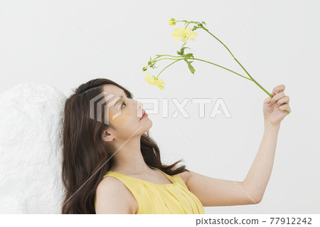 beautiful Asian model in yellow dress, spring beauty concept beautiful Asian model in yellow dress, spring beauty concept 77912242