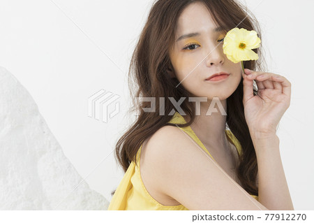 beautiful Asian model in yellow dress, spring beauty concept beautiful Asian model in yellow dress, spring beauty concept 77912270