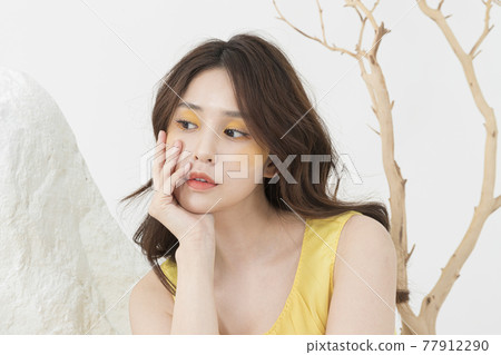 beautiful Asian model in yellow dress, spring beauty concept beautiful Asian model in yellow dress, spring beauty concept 77912290
