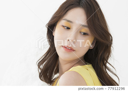 beautiful Asian model in yellow dress, spring beauty concept beautiful Asian model in yellow dress, spring beauty concept 77912296