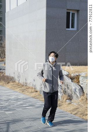 Asian man walking, strolling, jogging with mask Asian man walking, strolling, jogging with mask 77912811