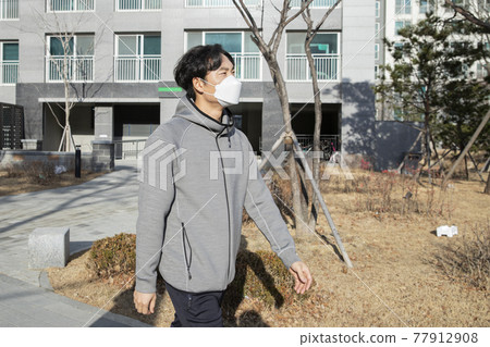 Asian man walking, strolling, jogging with mask Asian man walking, strolling, jogging with mask 77912908