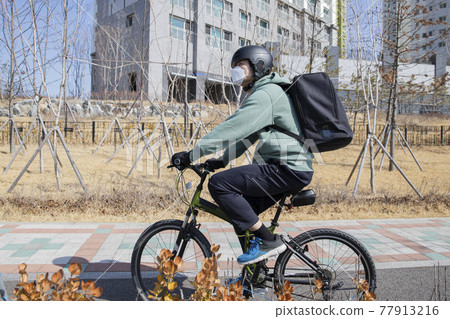 bike delivery service man with mask bike delivery service man with mask 77913216
