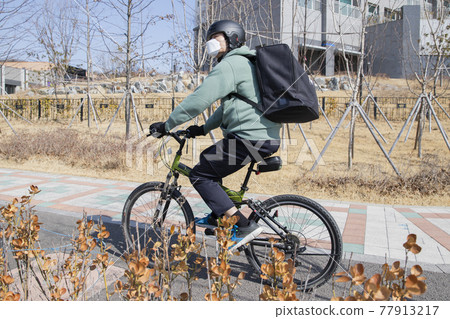 bike delivery service man with mask bike delivery service man with mask 77913217