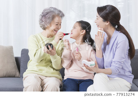 three generations of women, Asian grandmother, mother and grand daughter 77913274
