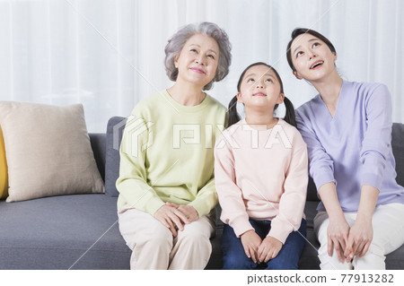 three generations of women, Asian grandmother, mother and grand daughter 77913282